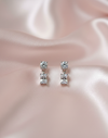 The Crystal Cascade: Silver Rhodium Drop Earrings with Emerald Cut Stone